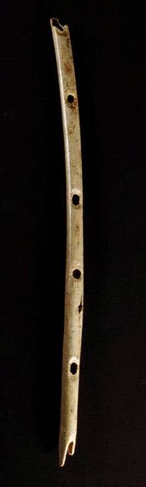 <strong>LOST AND FOUND </strong> Scientists say that this bone flute, found at Hohle Fels Cave in Germany, is at least 42,000 years old.
